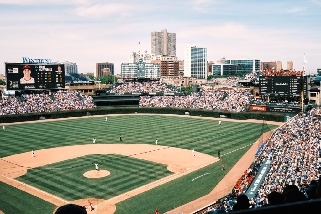 Wide-angle shot of Wrigley Field filled with spectators during a baseball game in Chicago.