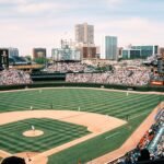 Wide-angle shot of Wrigley Field filled with spectators during a baseball game in Chicago.