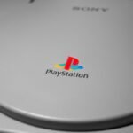 Detailed close-up of iconic PlayStation console logo, perfect for gaming-related content.